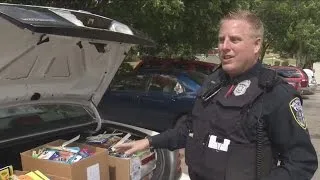 Milwaukee police officer surprises kids with school supplies