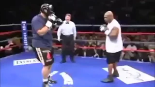 Mike Tyson stops opponent from going down!