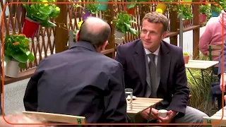 French President Emmanuel Macron drinks coffee at café terrace