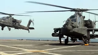 Вертолеты Apache Land на корабле для пополнение боезаряда