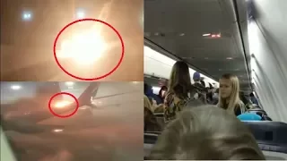 Passengers scream in terror as plane bursts into flames after crash with other jet on runway.