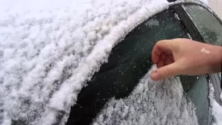 Scraping ice off the car