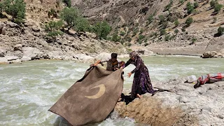 Washing blankets and clothes in the river by nomadic family | Nomads of Iran 2023