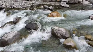 the relaxing sound of the flowing river water brings peace of mind