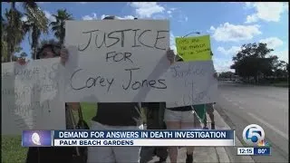 Protesters rally outside of Palm Beach Gardens Police Department