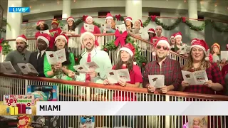 Christmas carolers spread joy during Big Bus Toy Express stop in Miami