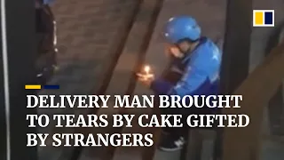 Delivery man in China brought to tears by cake gifted by strangers