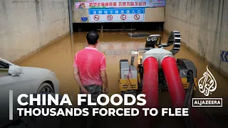 China floods: Tens of thousands forced to flee rising water