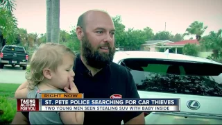 Two young men seen stealing SUV with baby inside