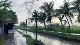 Rain in a beautiful village by the river||village atmosphere||rural Indonesia