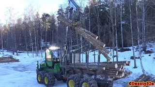 4K| John Deere 910G Forwarder Unloading Timber