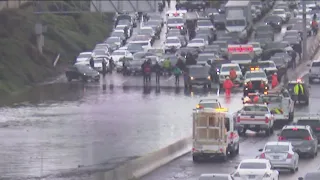 Almost all lanes open on I-15 northbound at Main Street after flooding stopped cars for hours