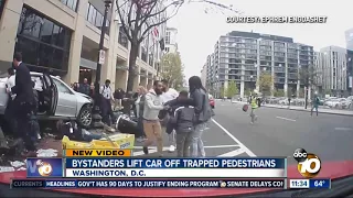 Bystanders lift car off trapped D.C. pedestrians