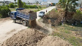 Wonderful New Initiative! Using dump truck and a bulldozer while pushing soil, filling it in