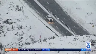 Motorists still stranded after snow shuts down Highway 18