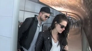 Kristen Stewart "in love" with Robert Pattinson at Charles de Gaulle airport heading back to LA