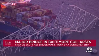 Major bridge in Baltimore collapses after being struck by container ship, people in water