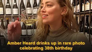 Amber Heard drinks up in rare photo celebrating 38th birthday