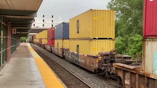 CSX 3447 leads a long eastbound stacker past the Syracuse train depot with horn salutes