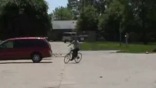 Riding motorized bike around parking lot