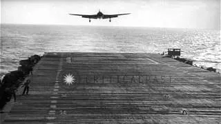 A F4F Wildcat aircraft tumbles into ocean while attempting to land on the deck of...HD Stock Footage