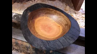 Richard Raffan turns and burns to create a natural edge bowl.