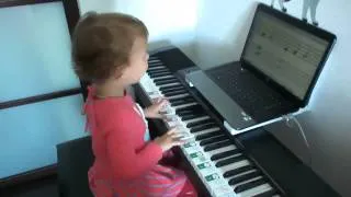 3-year-old baby learning to play piano, to sight-read and to sing