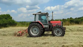 Massey Ferguson 3070 rowing up hay.