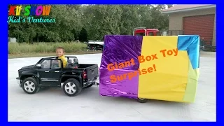 Hauling A Giant Box Toy Surprise Using His Power Wheels Ride On Chevy Truck And Custom Built Trailer