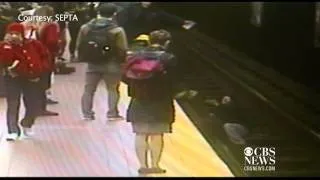 Man falls onto train tracks, rescued