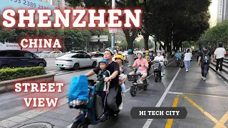 Shenzhen China HI TECH City Street View Electric Bikes Everywhere Busy Road #peoplewatching