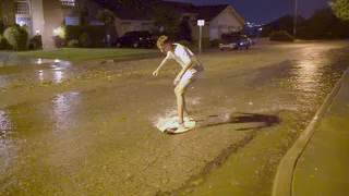 Street Skimboarding during a flash flood in St. George, Utah