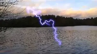 Close Lightning strikes seen on a lake