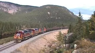 ALCO's (MLW) chug north on the Cartier in beautiful Quebec. 9/17/2000