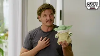 Pedro Pascal with Grogu toy