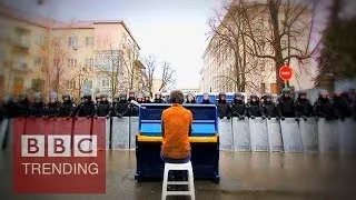 Playing the piano to riot police