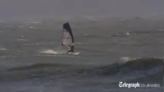 Windsurfers ride storm waves in Dorset