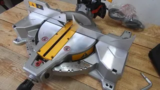 Unpacking the miter saw DEWALT DWS713