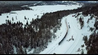 4K- Aerial View Two Trains through the Snow on Donner Pass (Norden, CA)