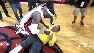 LeBron James tackles heat fan who hits $75,000 shot!!