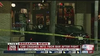 Car crashes into Ybor City bar after fight, police searching for driver
