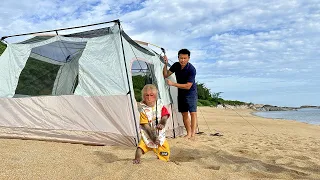 Bibi helps Dad set up a camping tent at the beautiful beach!