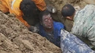 Dramatic rescue of man buried in earth pit in east China