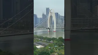 Flying Car Fly Across the Canton Tower