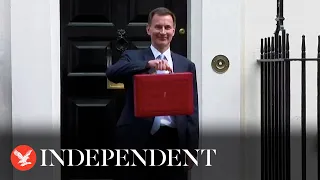 Spring Budget: Jeremy Hunt holds up ministerial red box outside Downing Street