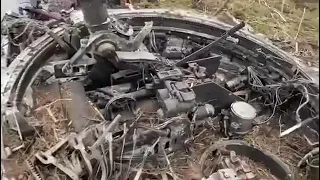 Ukraine forces assess a destroyed Russian BMP-3