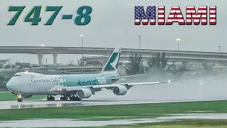 CATHAY Boeing 747-8 departs a wet MIAMI runway