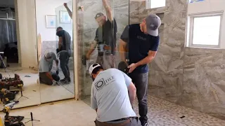 WE ALMOST BREAK IT!! -- Tile Guys Installing A MASSIVE Glass Panel