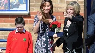 Kate Middleton shows growing bump during visit to Manchester school