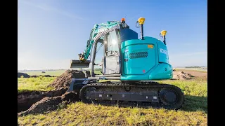 Trimming Stone with a Kobelco SK85 MSR Fine grading Digger Excavator